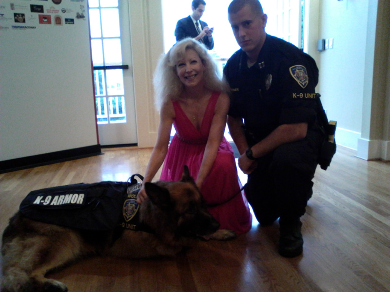 K-9 Armor Co-founder Suzanne Saunders and ESA K-9 Unit Handler Andy Greiner and K9 Wolfie. 
