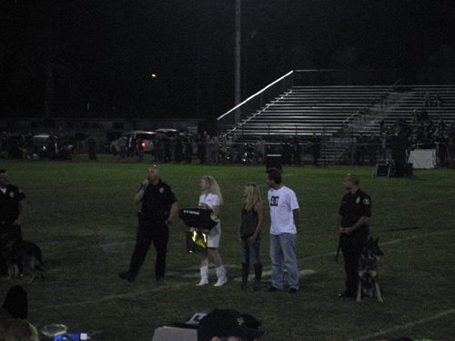 Anaheim PD Officer Boncawicz with K9 Cisko, OCPCA Pres and Irvine PD K9 Officer Bob Smith, K-9 Armor CoFounder Suzanne Saunders presenting a bulletproof K9 Armor vest thanks to sponsors Krista and Mike Pennington, followed by Huntington Beach PD Officer Ricci with K9 Xavi at the Orange County Police Canine Association K9 Benefit Show, October 15, 2011